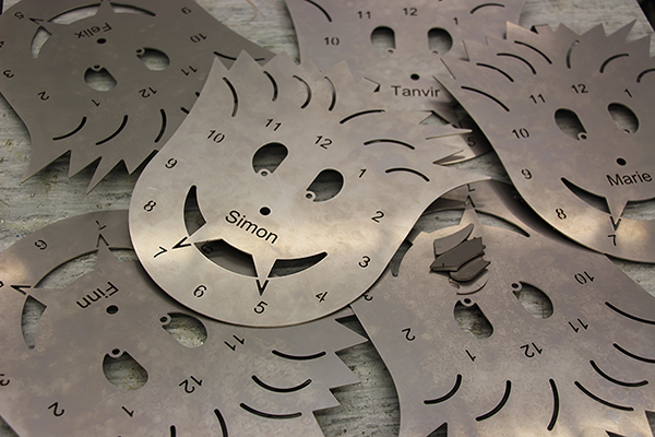 Kids cut their own custom clock faces at TRUMPF's Knowledge Factory